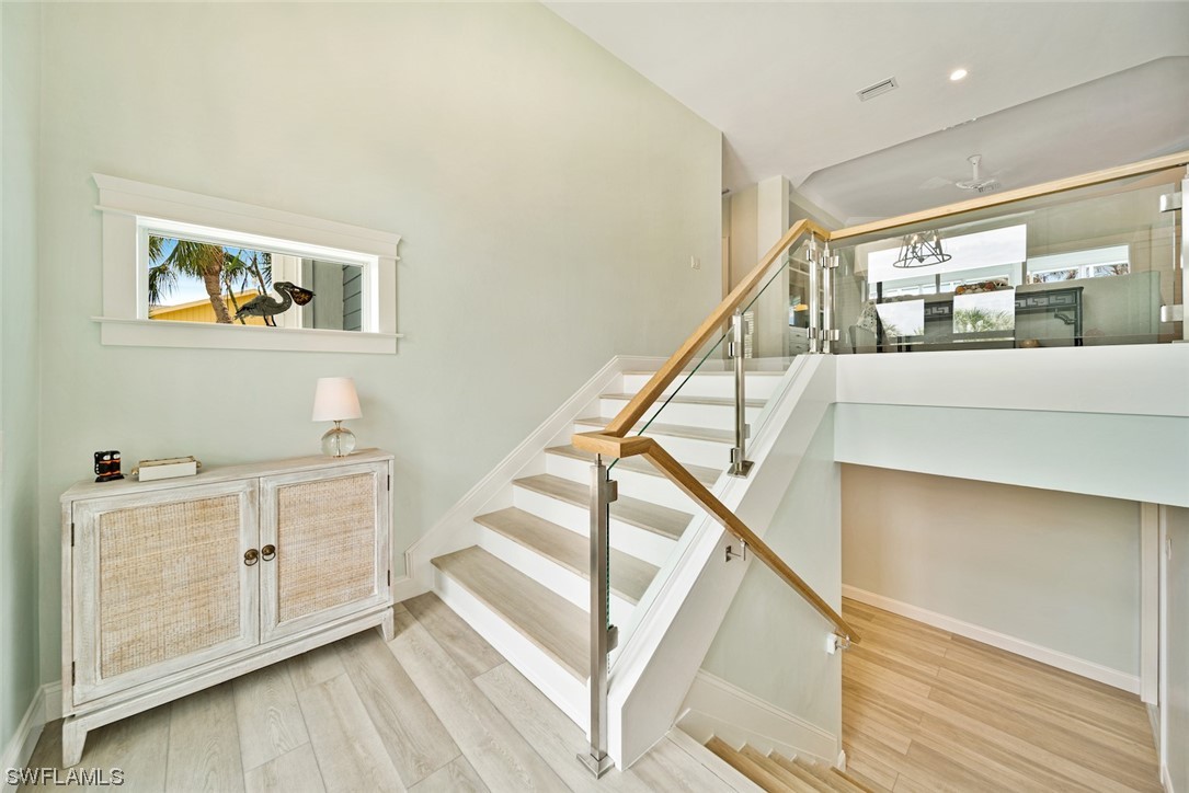 5294 Umbrella Pool Road Sanibel, FL 33957 - Photo 6 of 44 a view of entryway and hall with wooden floor