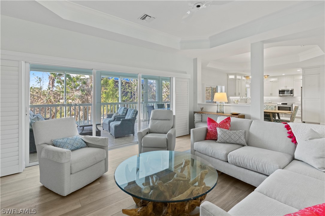 5294 Umbrella Pool Road Sanibel, FL 33957 - Photo 9 of 44 a living room with furniture and a large window