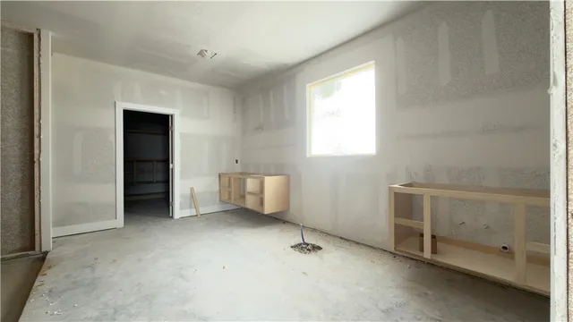 a view of an empty room with a window