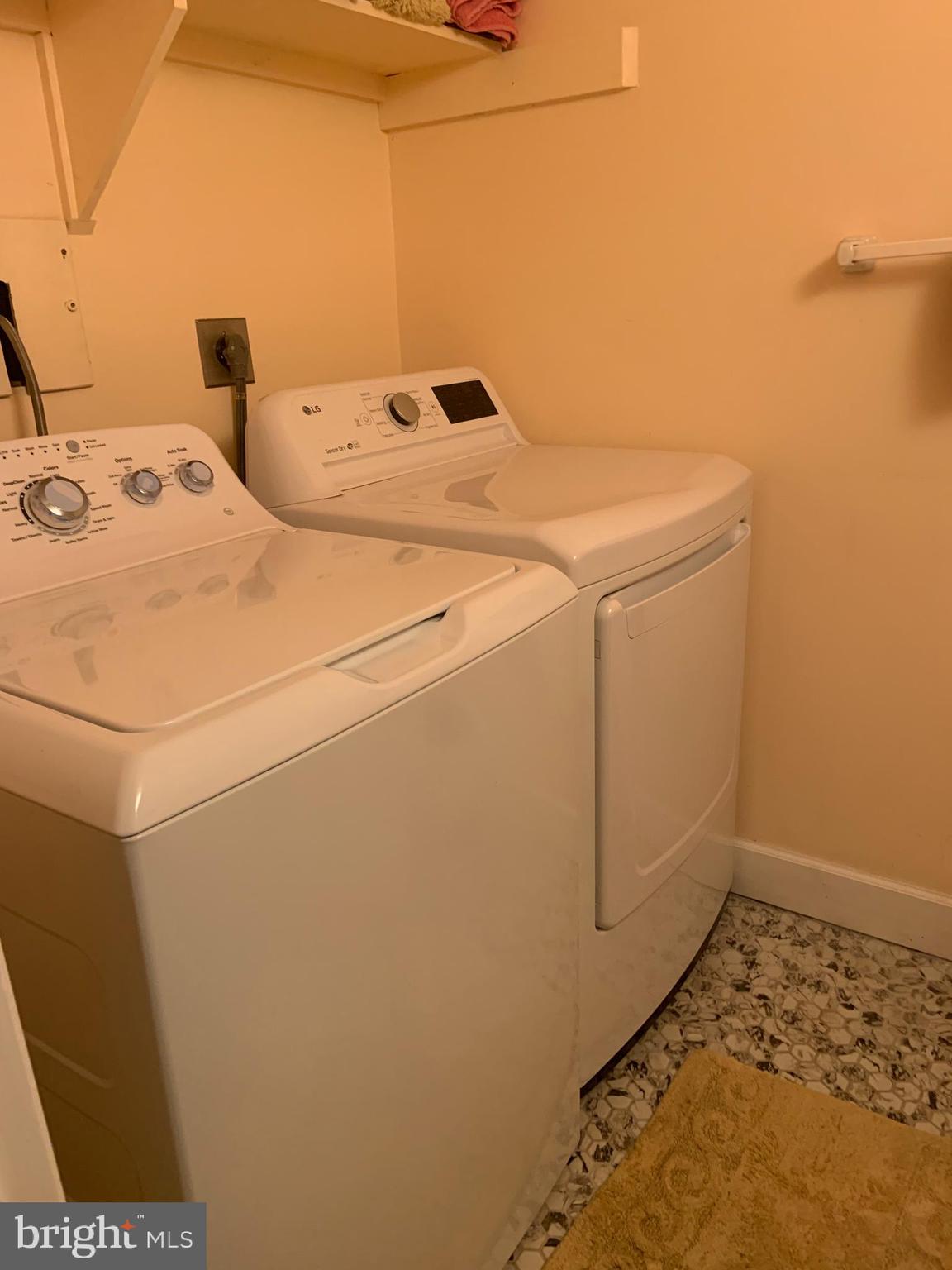 8210 Carrleigh Parkway, Unit 6 Springfield, VA 22152 - Photo 14 of 32 a utility room with dryer and washer