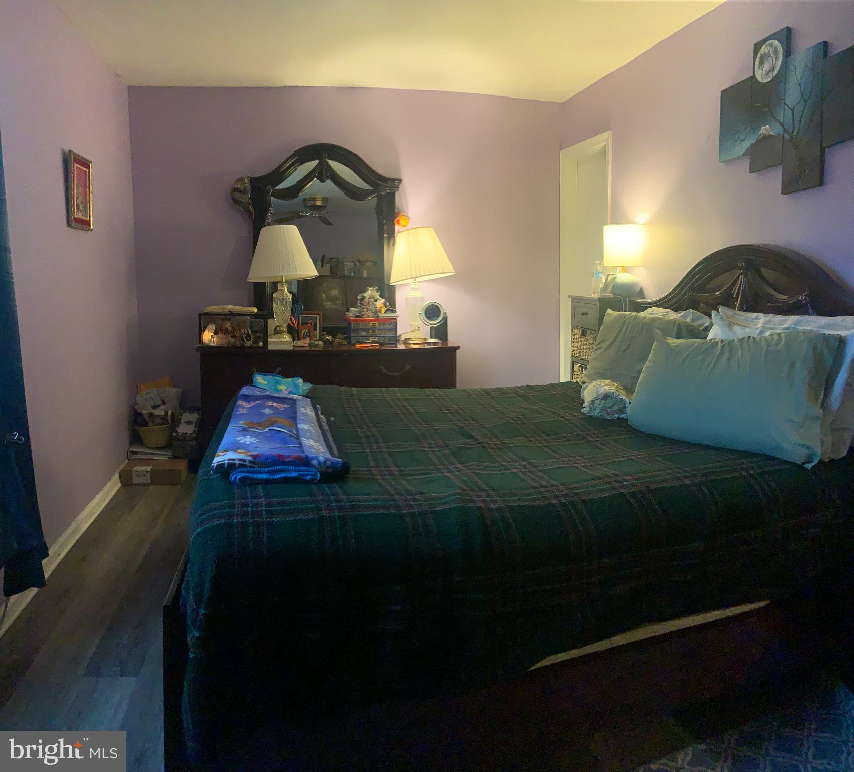 8210 Carrleigh Parkway, Unit 6 Springfield, VA 22152 - Photo 19 of 32 a bedroom with a bed and dresser