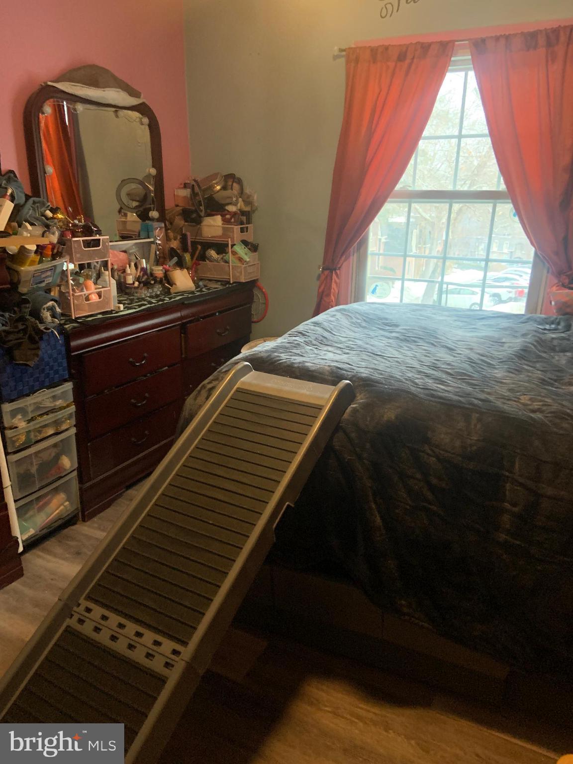 8210 Carrleigh Parkway, Unit 6 Springfield, VA 22152 - Photo 27 of 32 a bedroom with a bed next to a window