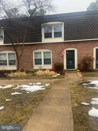 a view of a couches and dinning table in patio