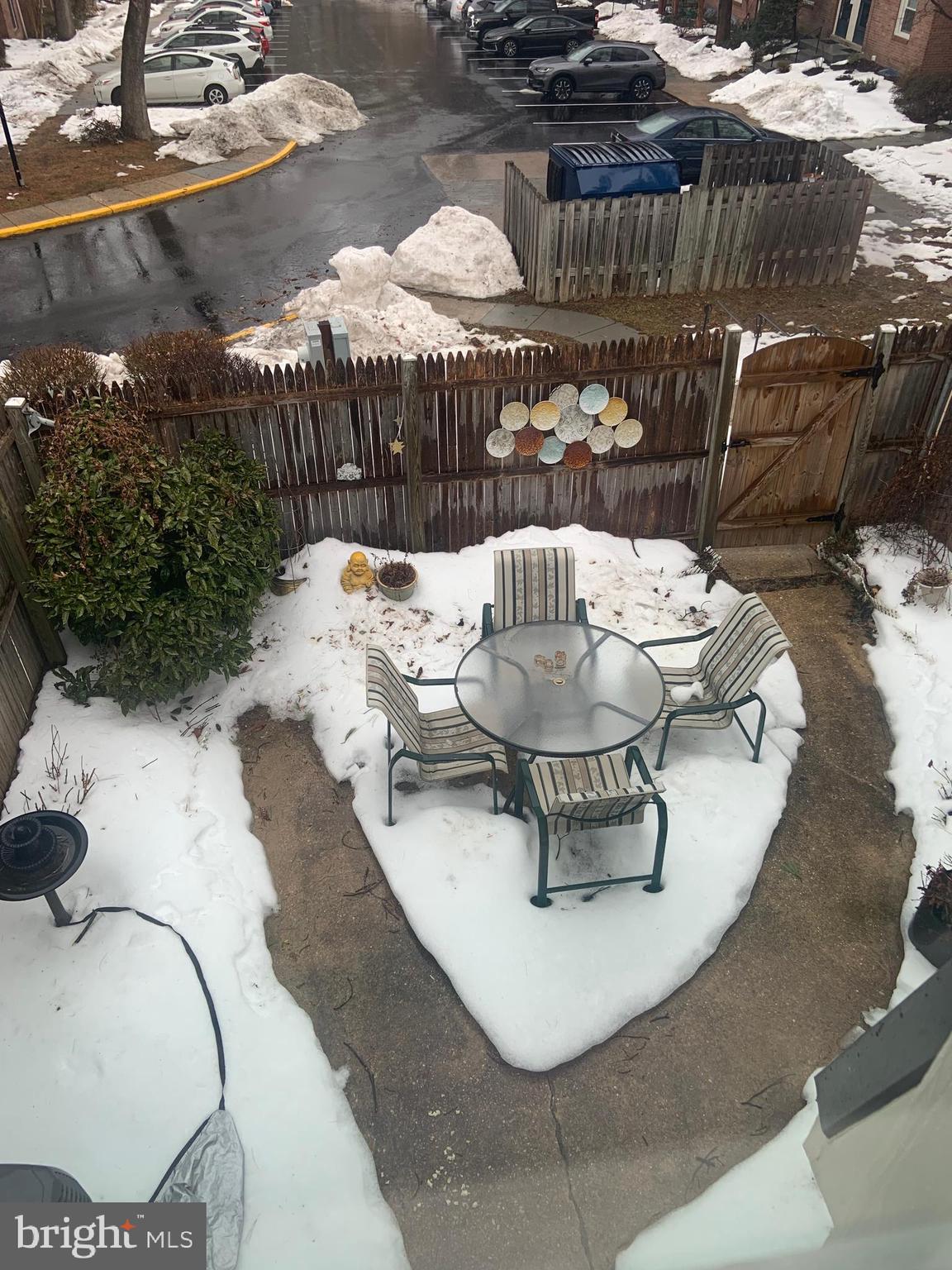 8210 Carrleigh Parkway, Unit 6 Springfield, VA 22152 - Photo 31 of 32 a view of a couches and dinning table in patio