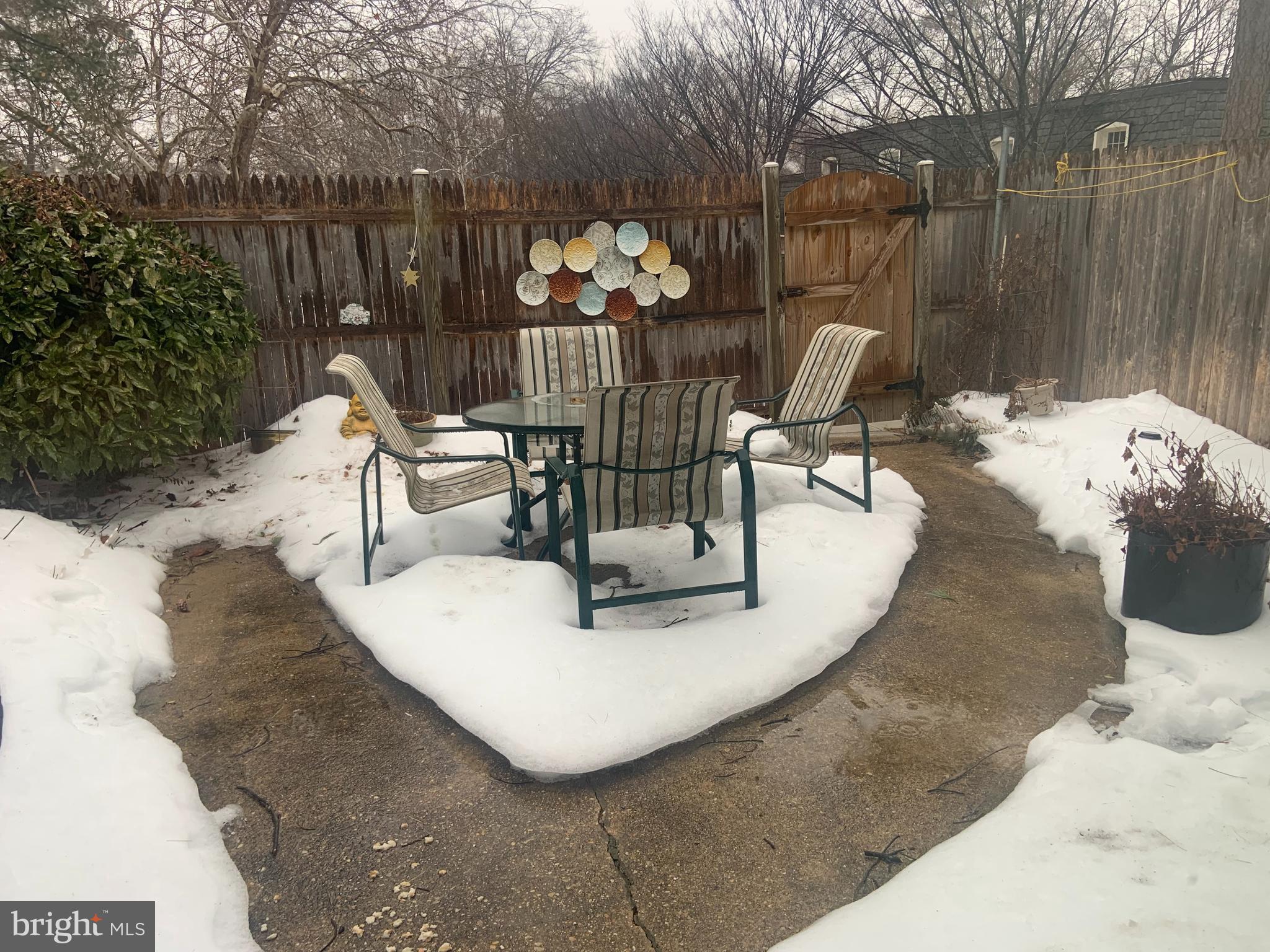 8210 Carrleigh Parkway, Unit 6 Springfield, VA 22152 - Photo 32 of 32 a view of a tables and chairs in patio