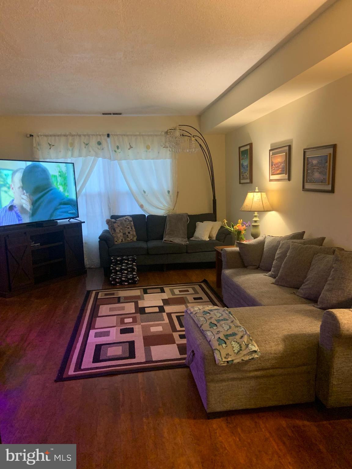 8210 Carrleigh Parkway, Unit 6 Springfield, VA 22152 - Photo 5 of 32 a living room with furniture and a couch
