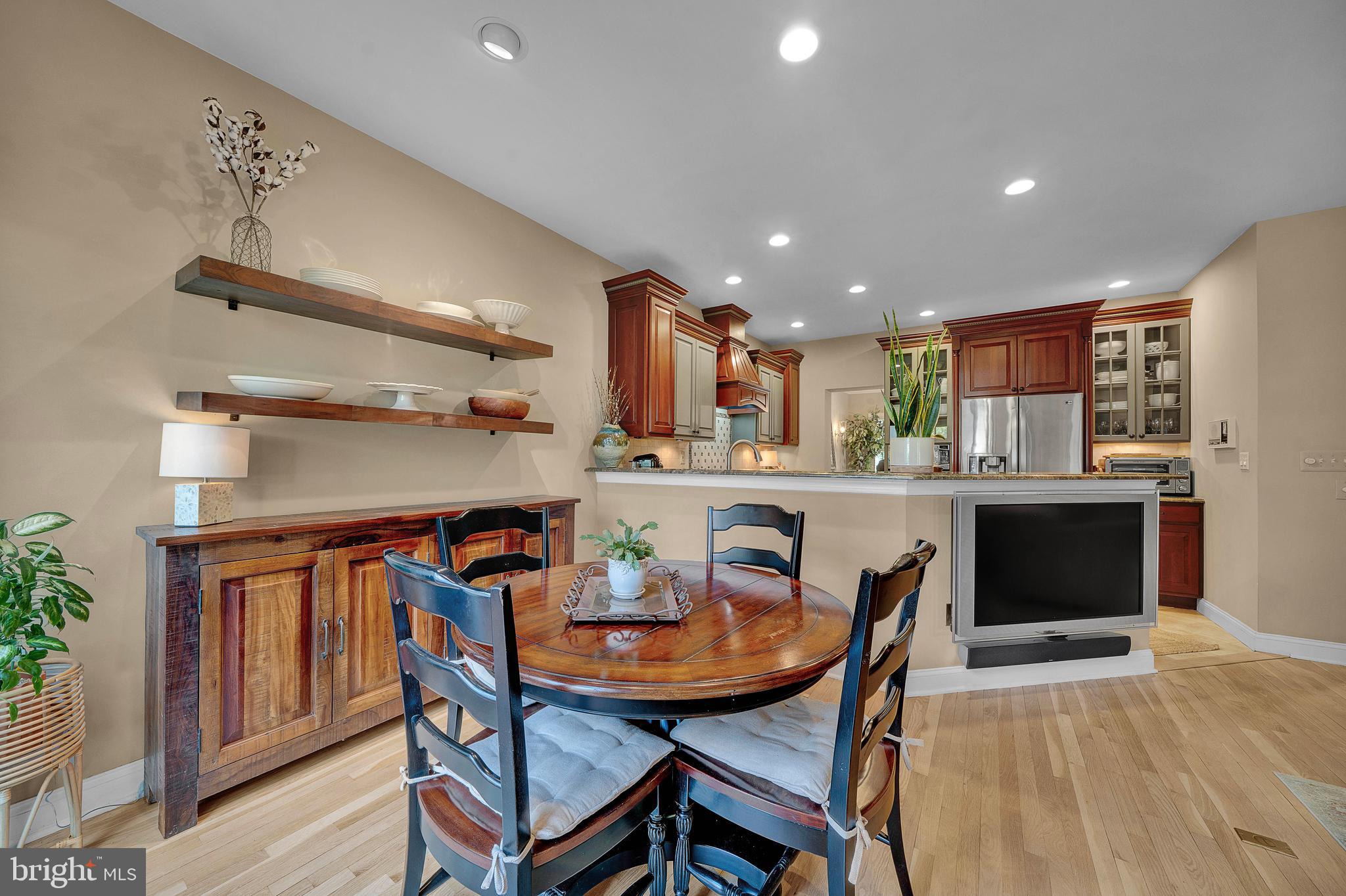 145 Sawgrass Drive Blue Bell, PA 19422 - Photo 14 of 61 a dining room with stainless steel appliances kitchen island a table and chairs