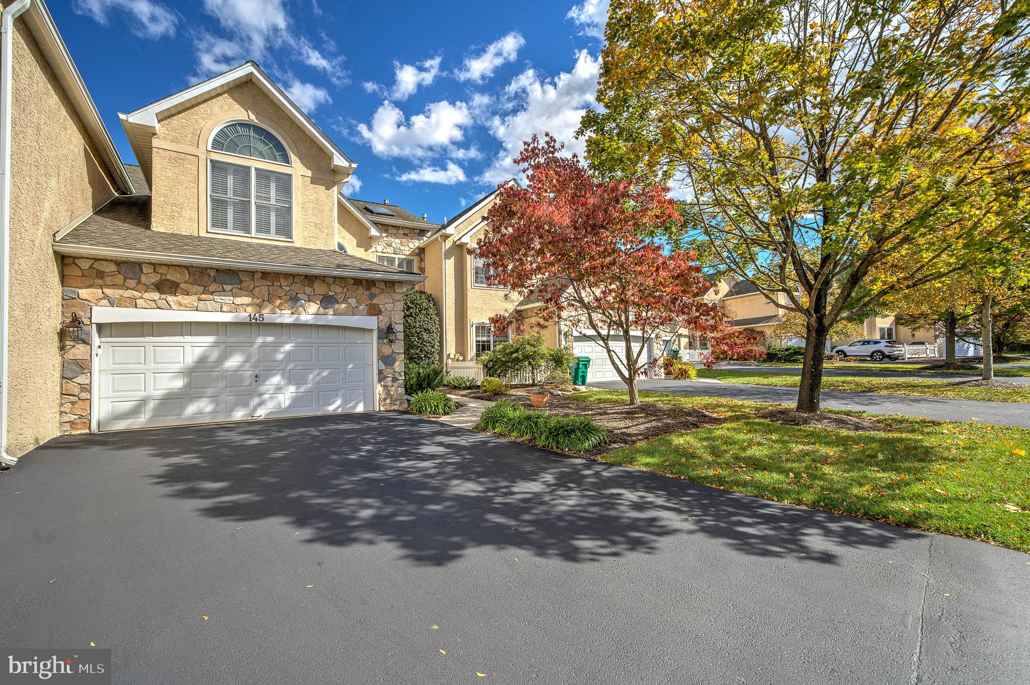 145 Sawgrass Drive Blue Bell, PA 19422 - Photo 2 of 61 a front view of a house with garden