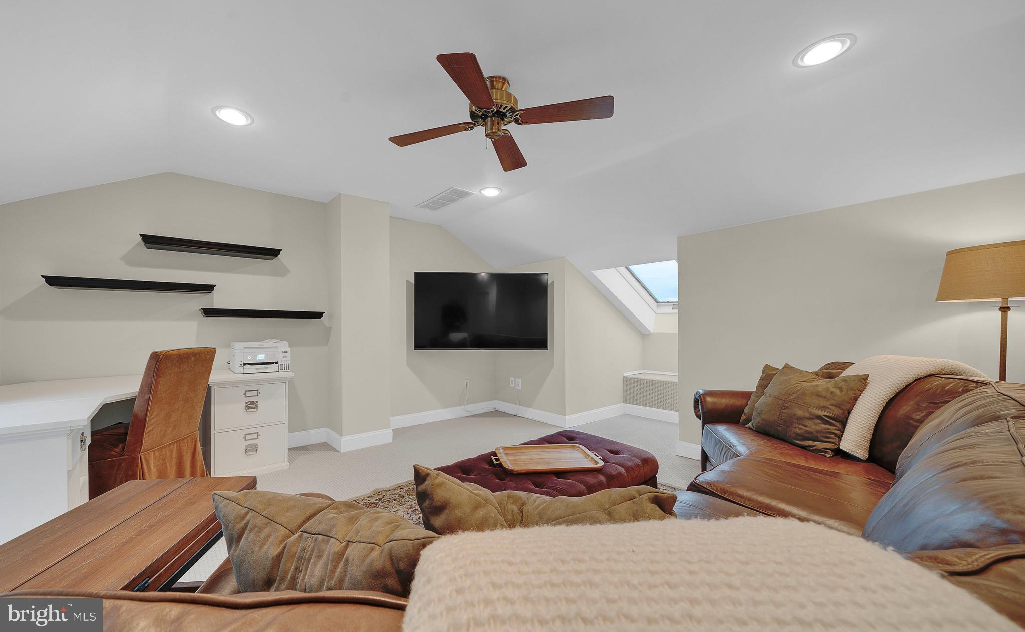 145 Sawgrass Drive Blue Bell, PA 19422 - Photo 22 of 61 a living room with furniture and a flat screen tv