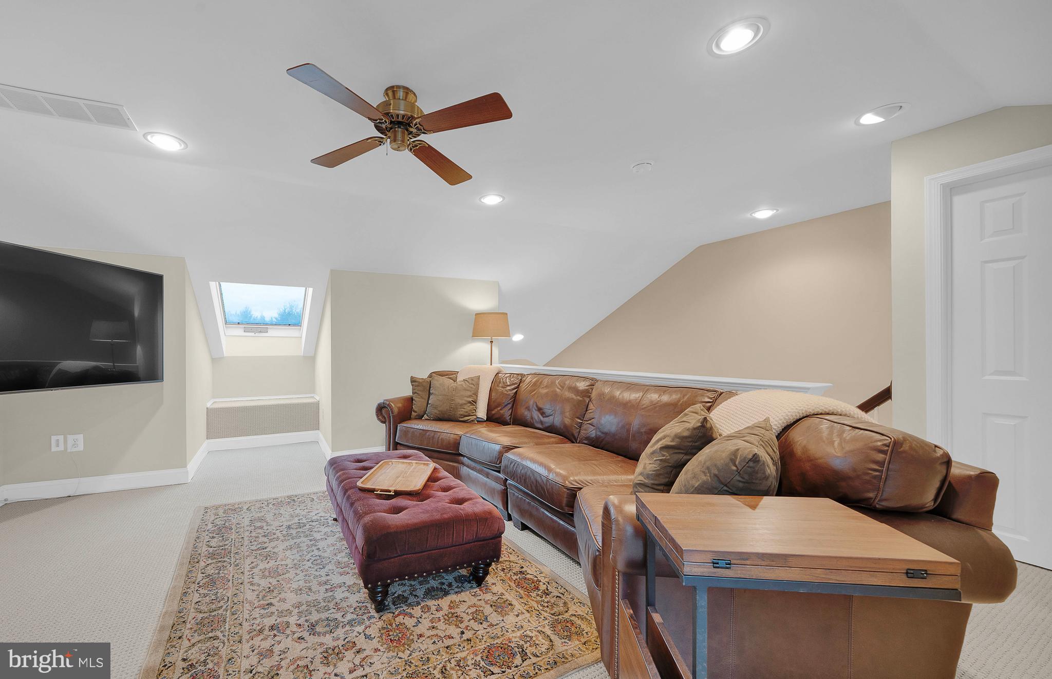 145 Sawgrass Drive Blue Bell, PA 19422 - Photo 23 of 61 a living room with furniture and a flat screen tv