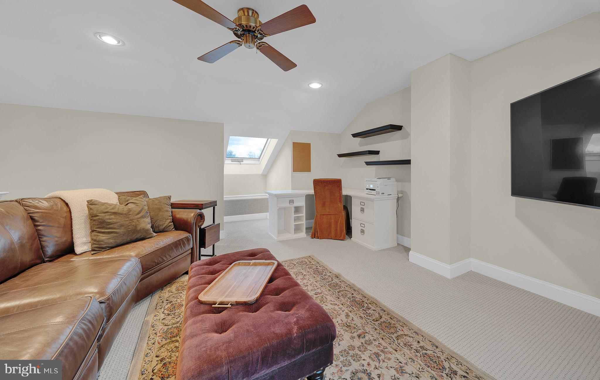 145 Sawgrass Drive Blue Bell, PA 19422 - Photo 25 of 61 a living room with furniture and a flat screen tv
