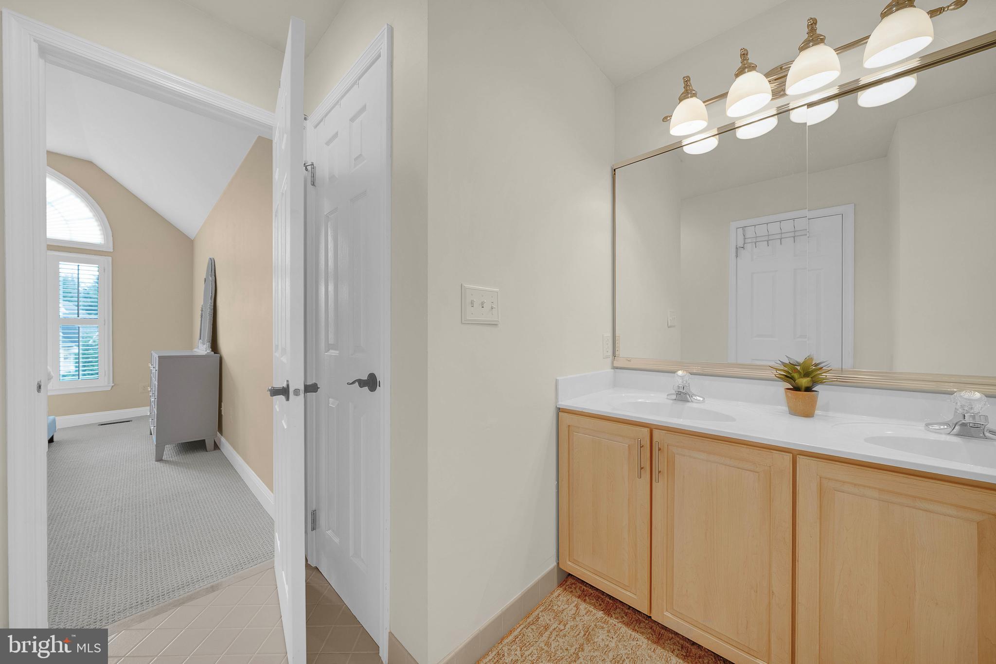 145 Sawgrass Drive Blue Bell, PA 19422 - Photo 31 of 61 a bathroom with a sink and mirror