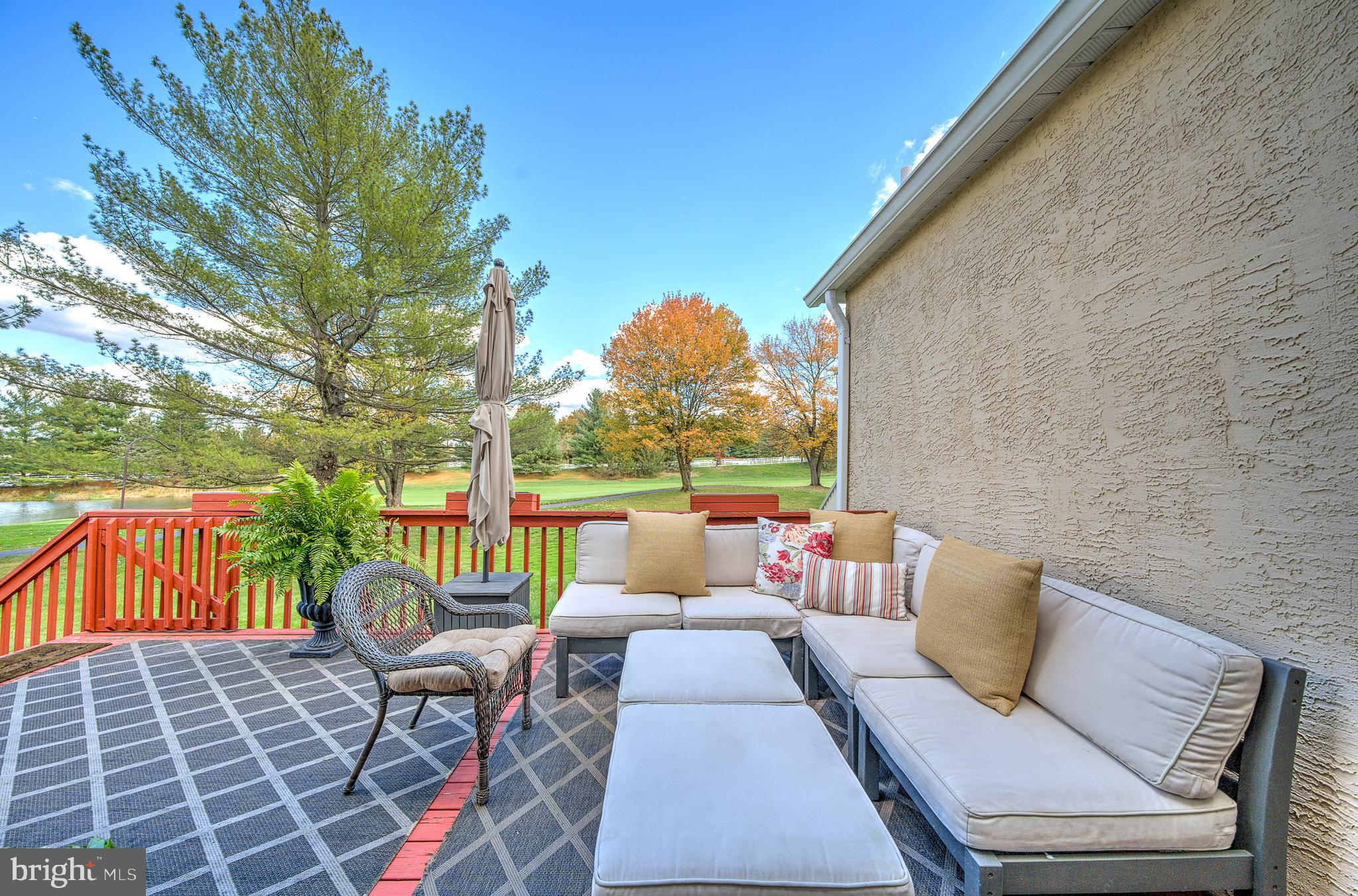 145 Sawgrass Drive Blue Bell, PA 19422 - Photo 40 of 61 a view of a patio with couches chairs and a potted plant