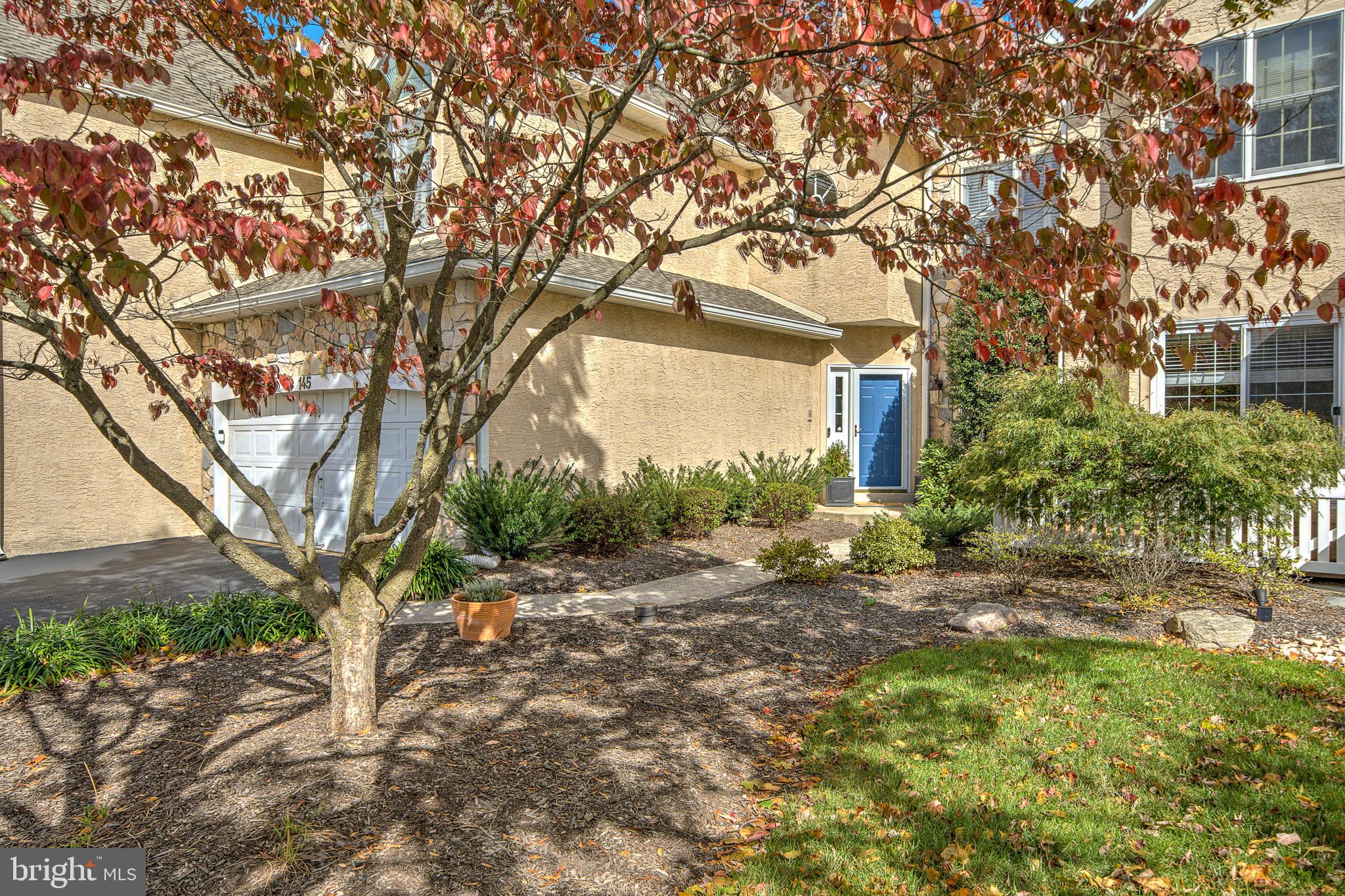 145 Sawgrass Drive Blue Bell, PA 19422 - Photo 4 of 61 a view of a house with a tree in the yard