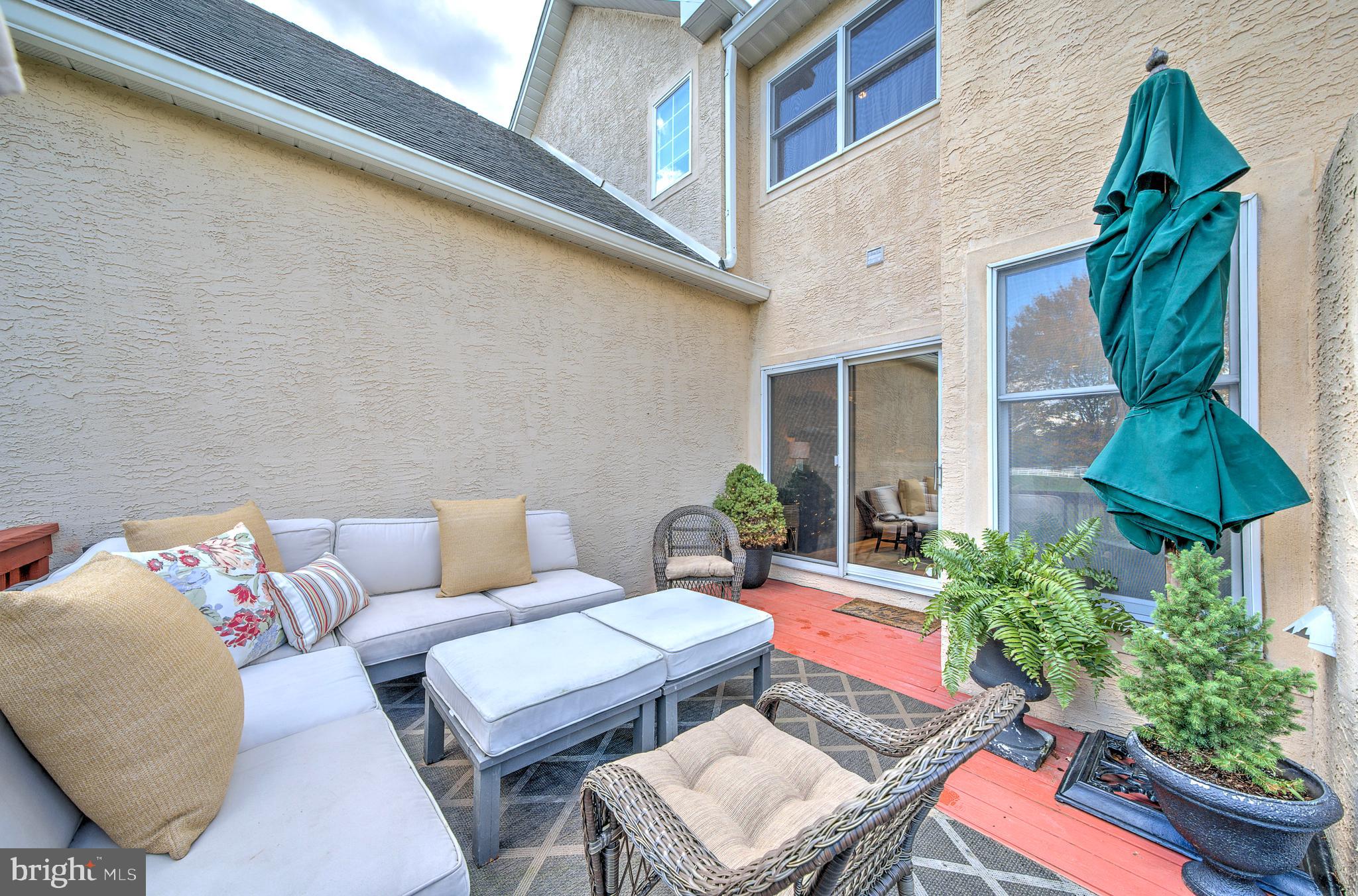 145 Sawgrass Drive Blue Bell, PA 19422 - Photo 42 of 61 a backyard of a house with outdoor seating