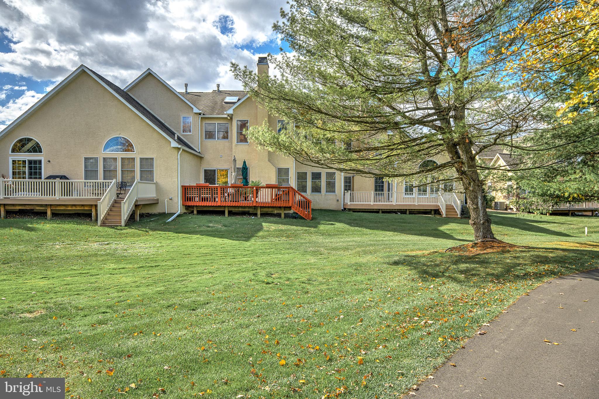 145 Sawgrass Drive Blue Bell, PA 19422 - Photo 43 of 61 a front view of a house with a yard table and chairs