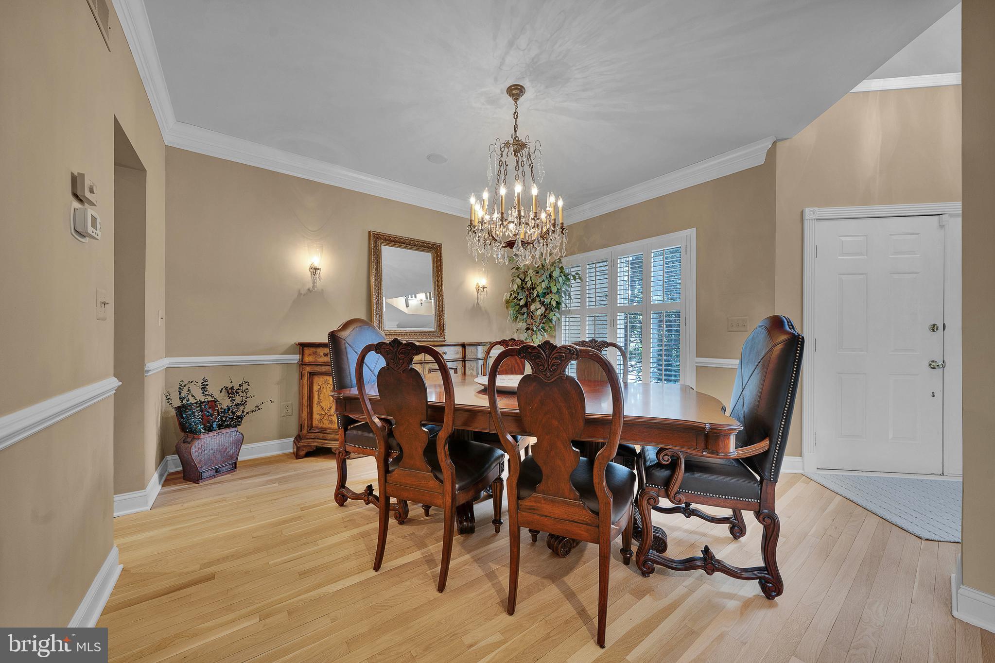 145 Sawgrass Drive Blue Bell, PA 19422 - Photo 5 of 61 a view of a dining room with furniture and wooden floor