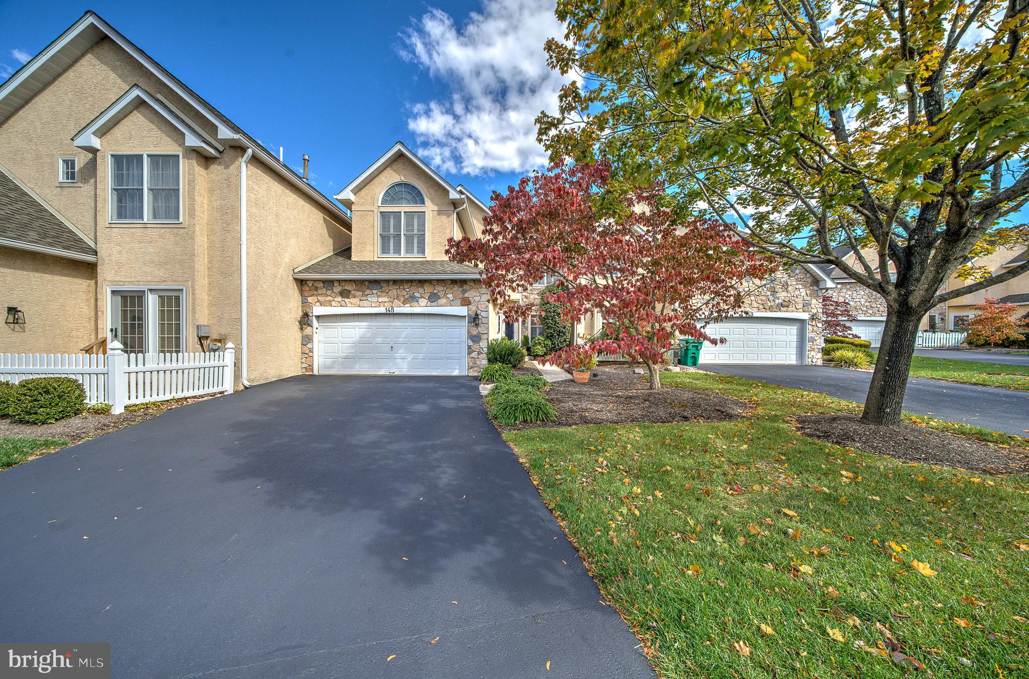 145 Sawgrass Drive Blue Bell, PA 19422 - Photo 61 of 61 a front view of a house with a yard and garage