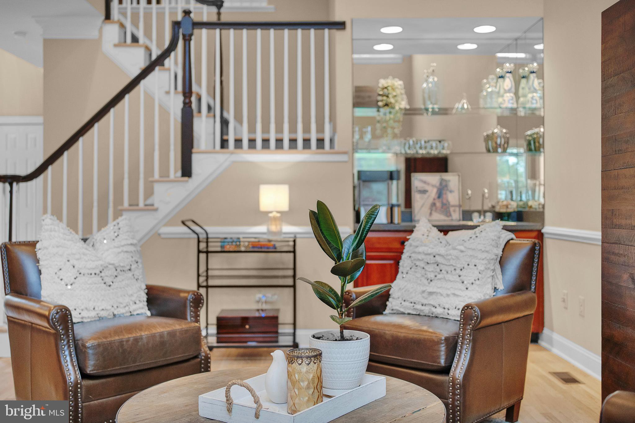 145 Sawgrass Drive Blue Bell, PA 19422 - Photo 8 of 61 a living room with furniture and a chandelier