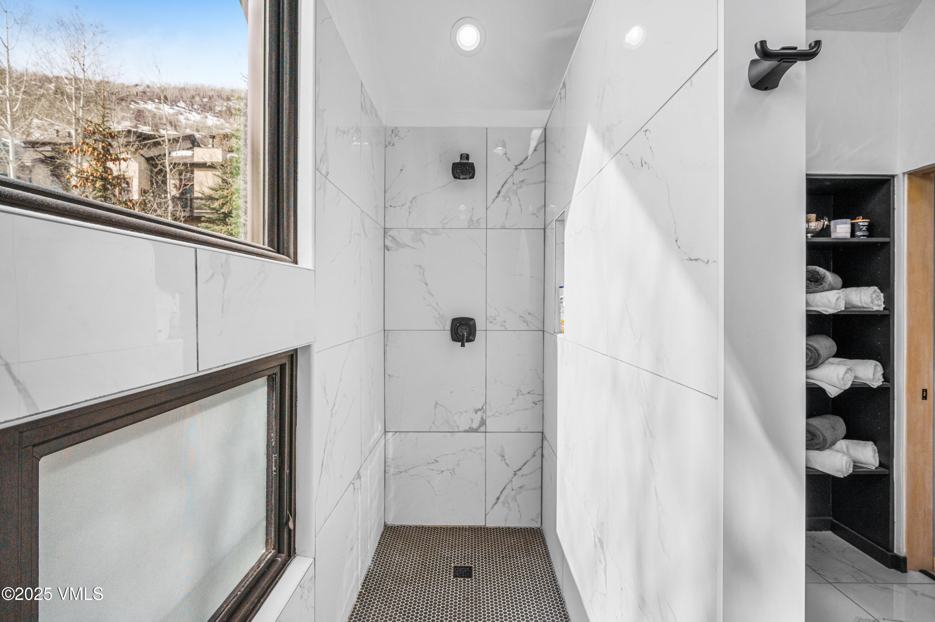 2349 Chamonix Lane Vail, CO 81657 - Photo 16 of 43 a bathroom with a shower