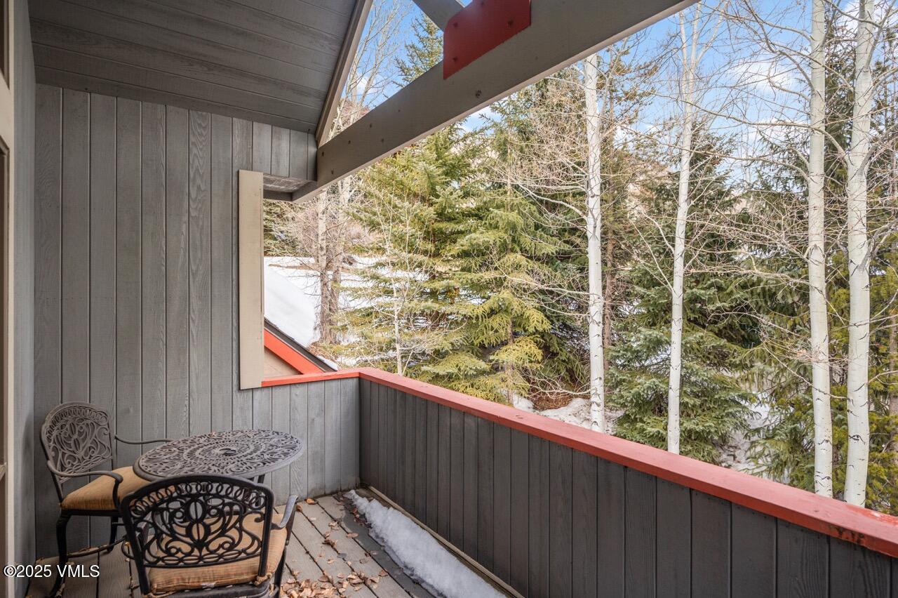 2349 Chamonix Lane Vail, CO 81657 - Photo 19 of 43 a balcony with table and chairs