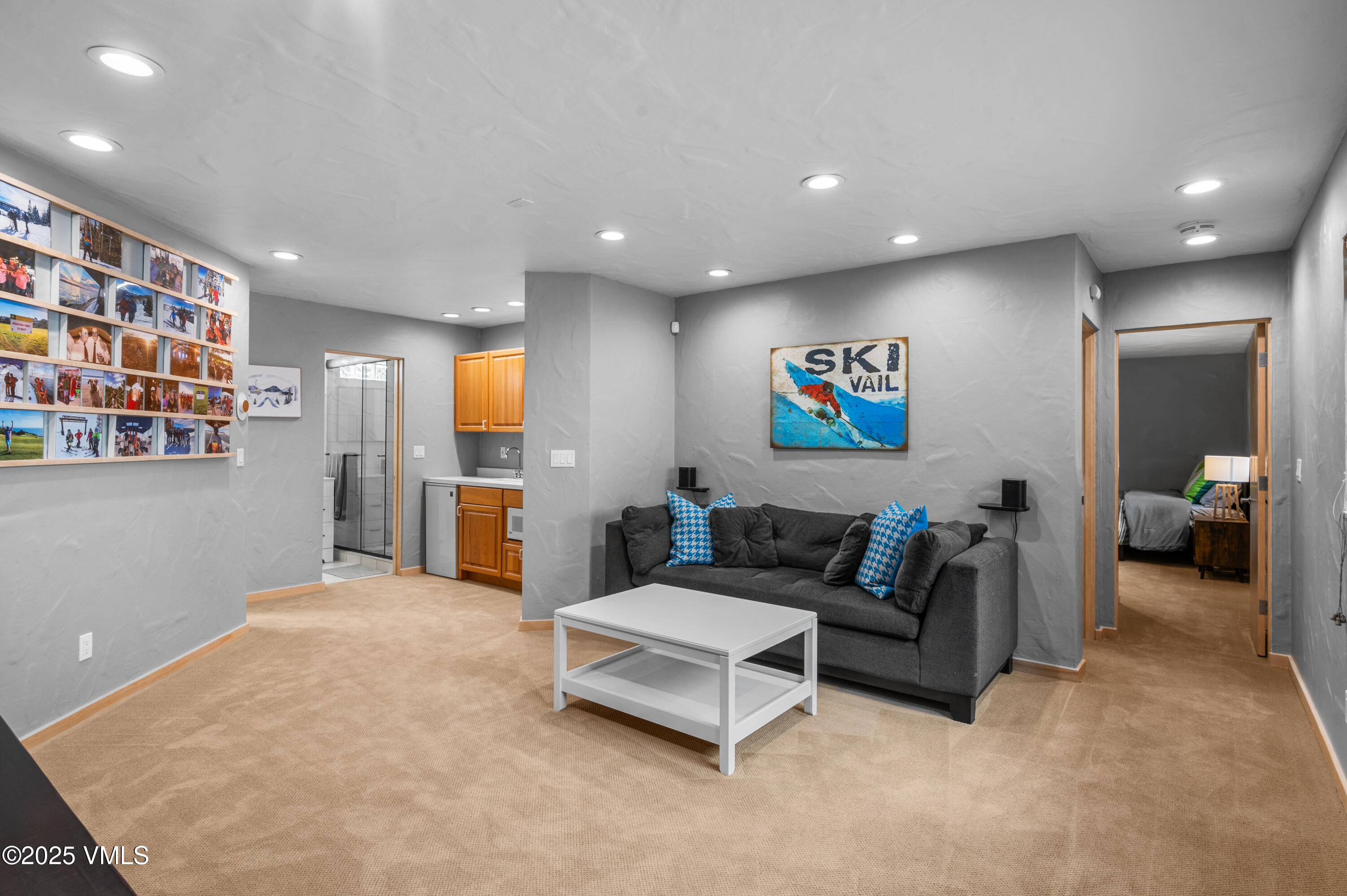 2349 Chamonix Lane Vail, CO 81657 - Photo 21 of 43 a living room with furniture and a flat screen tv