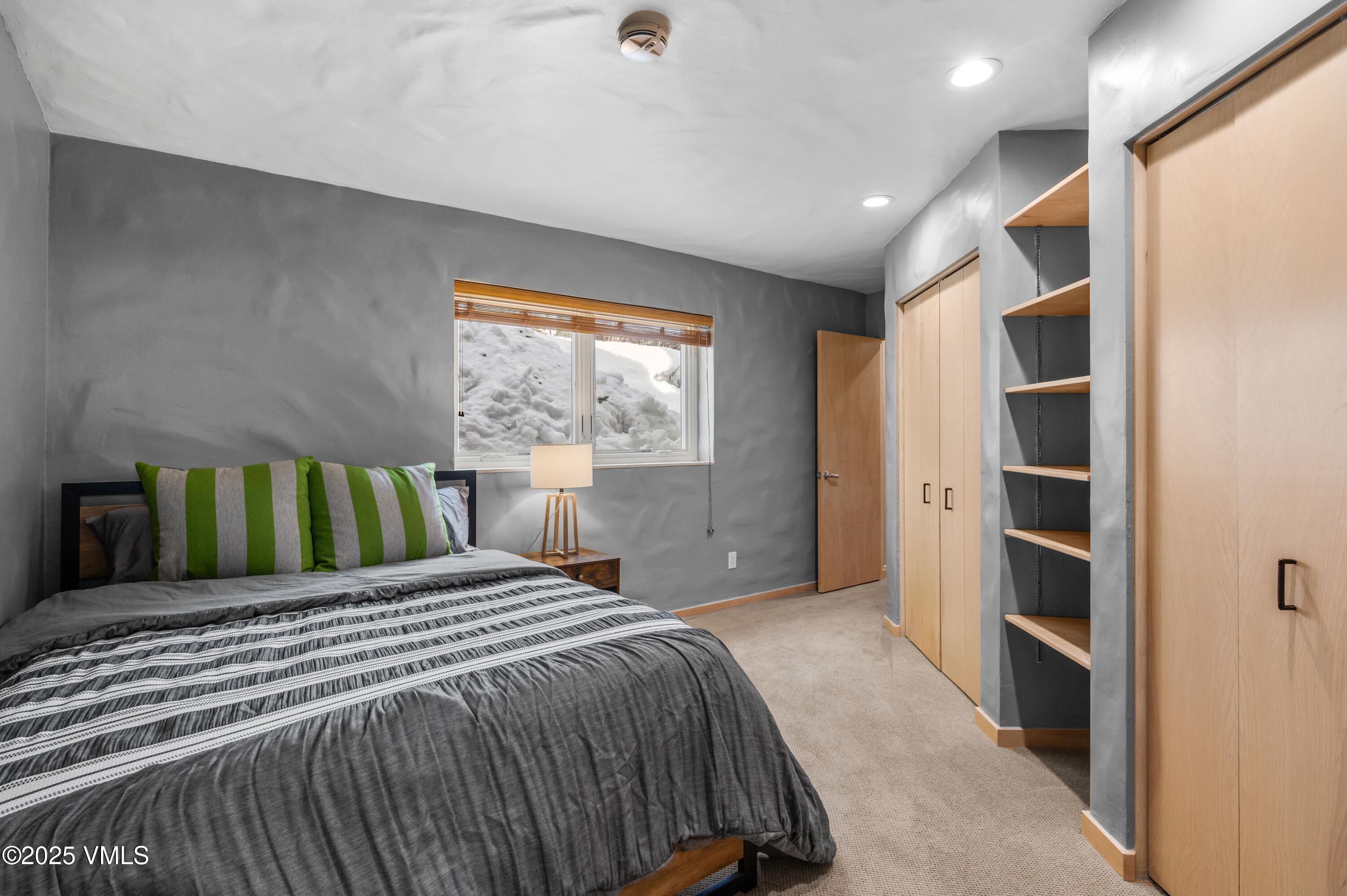 2349 Chamonix Lane Vail, CO 81657 - Photo 30 of 43 a bedroom with a bed and a window