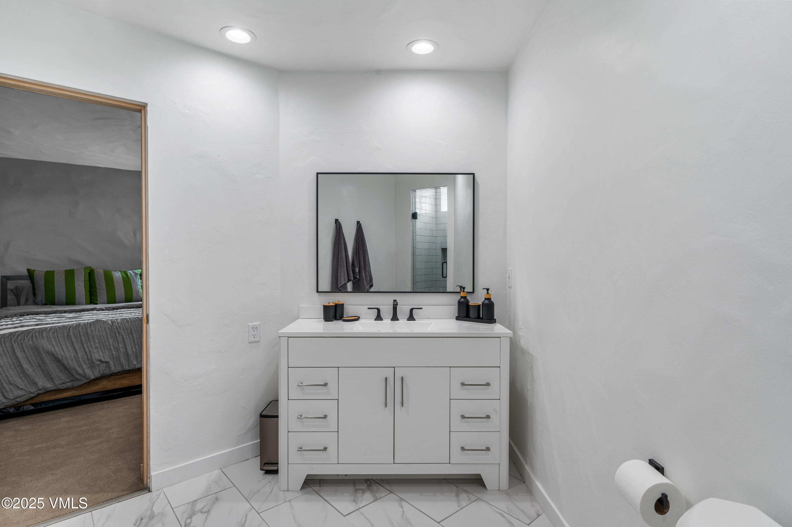 2349 Chamonix Lane Vail, CO 81657 - Photo 31 of 43 a bathroom with a sink and a mirror