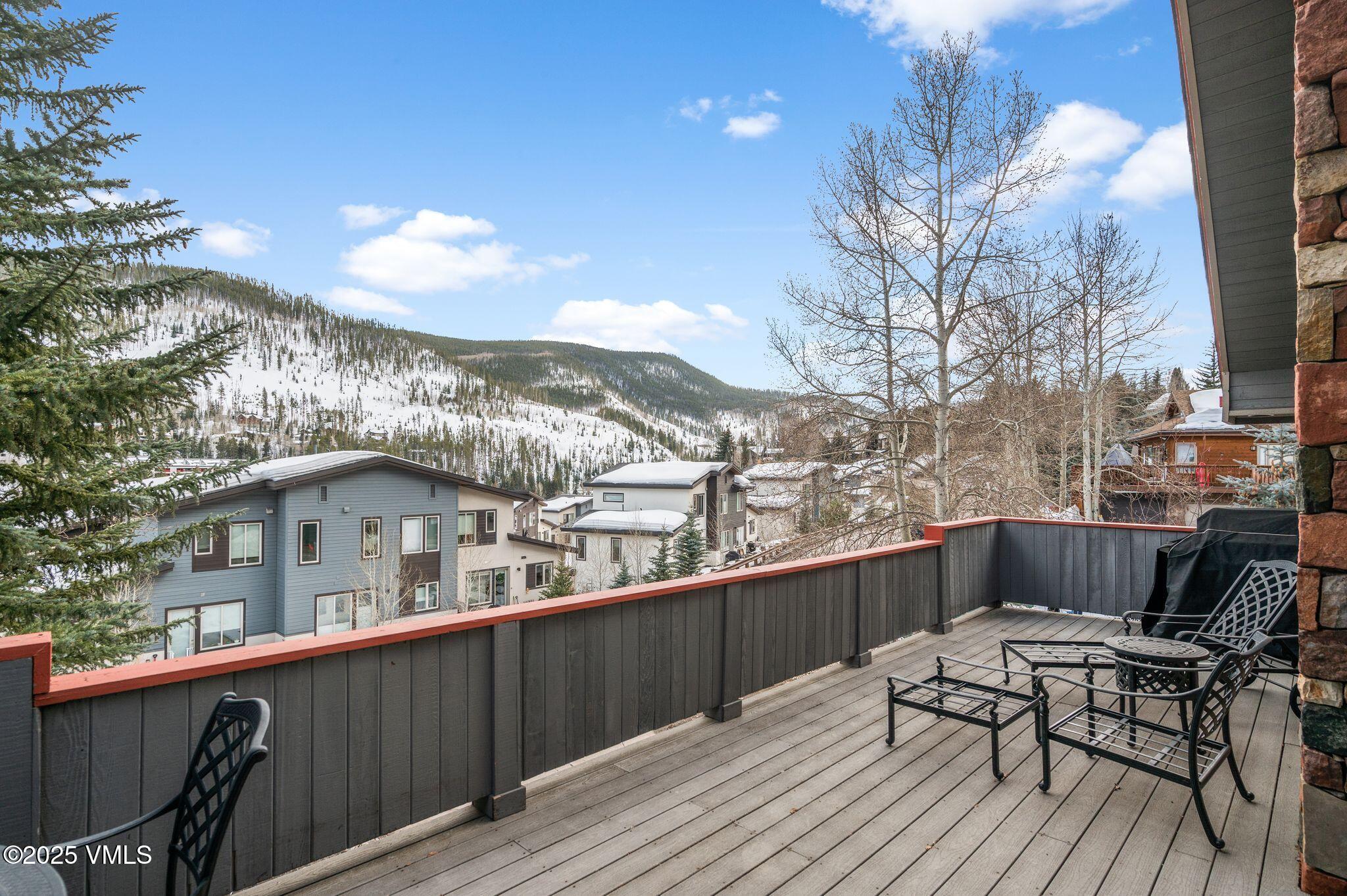 2349 Chamonix Lane Vail, CO 81657 - Photo 36 of 43 a view of a roof deck with chair and wooden floor