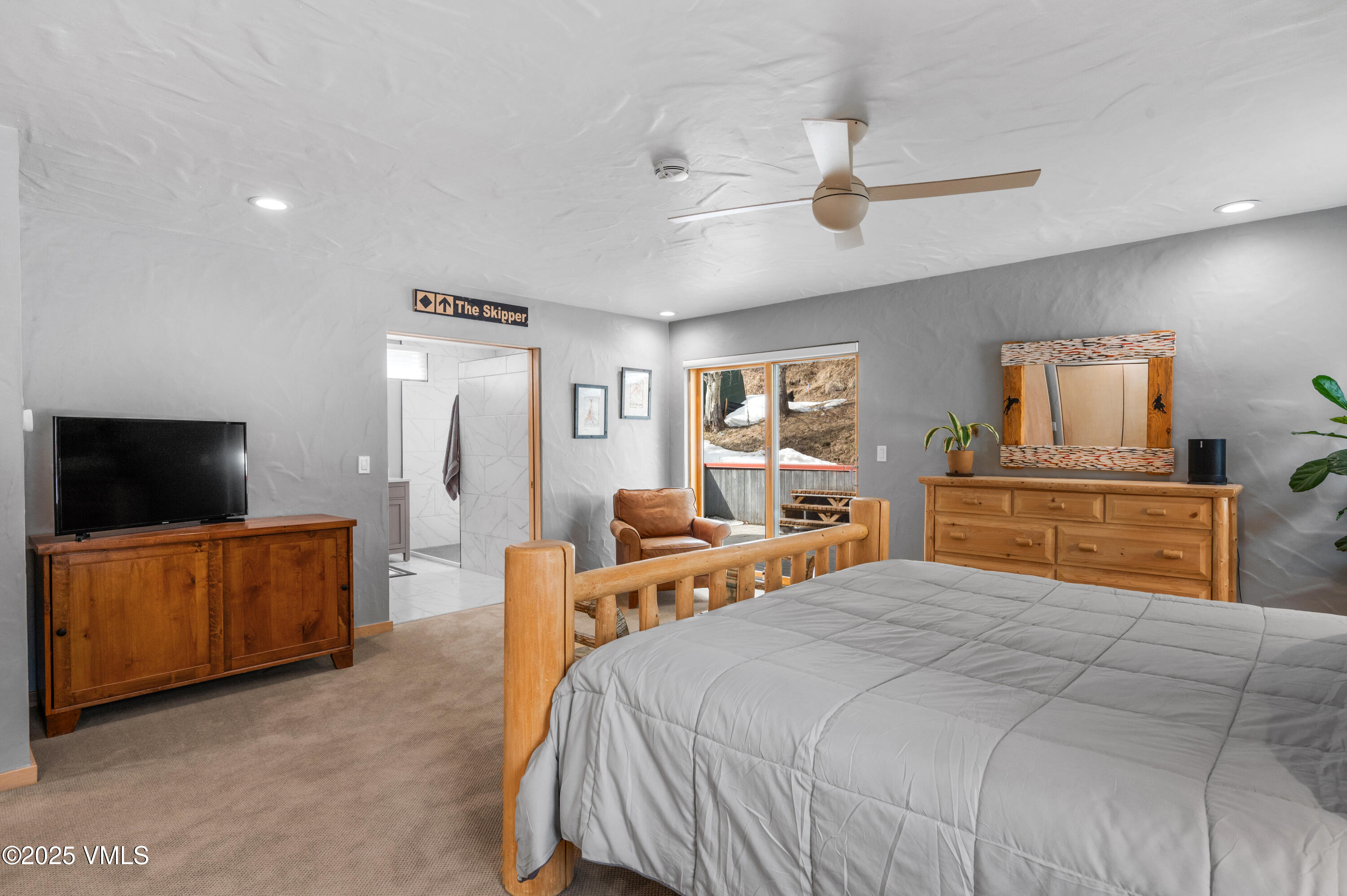 2349 Chamonix Lane Vail, CO 81657 - Photo 10 of 43 a bedroom with a bed and a television in it