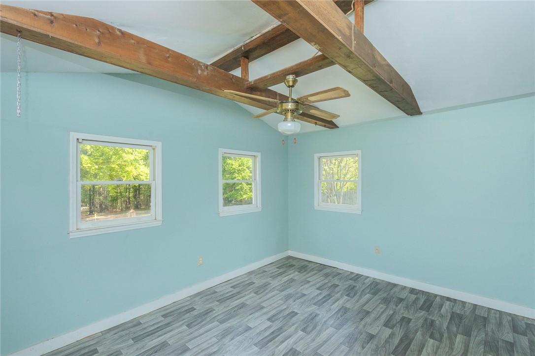 820 Travis Road Anderson, SC 29626 - Photo 20 of 46 This tranquil room offers beautiful outdoor views and exposed wooden beams for a rustic touch.