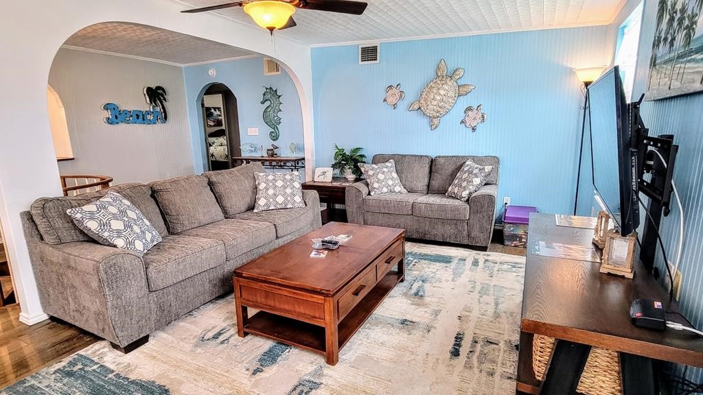619 Copano Cove Road Rockport, TX 78382 - Photo 11 of 32 a living room with furniture and a flat screen tv