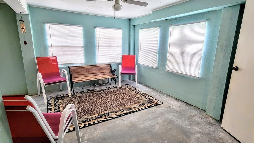 619 Copano Cove Road Rockport, TX 78382 - Photo 22 of 32 a living room with furniture and a window