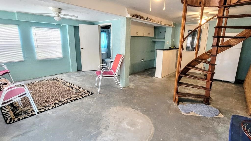 619 Copano Cove Road Rockport, TX 78382 - Photo 24 of 32 a bedroom with furniture and a window