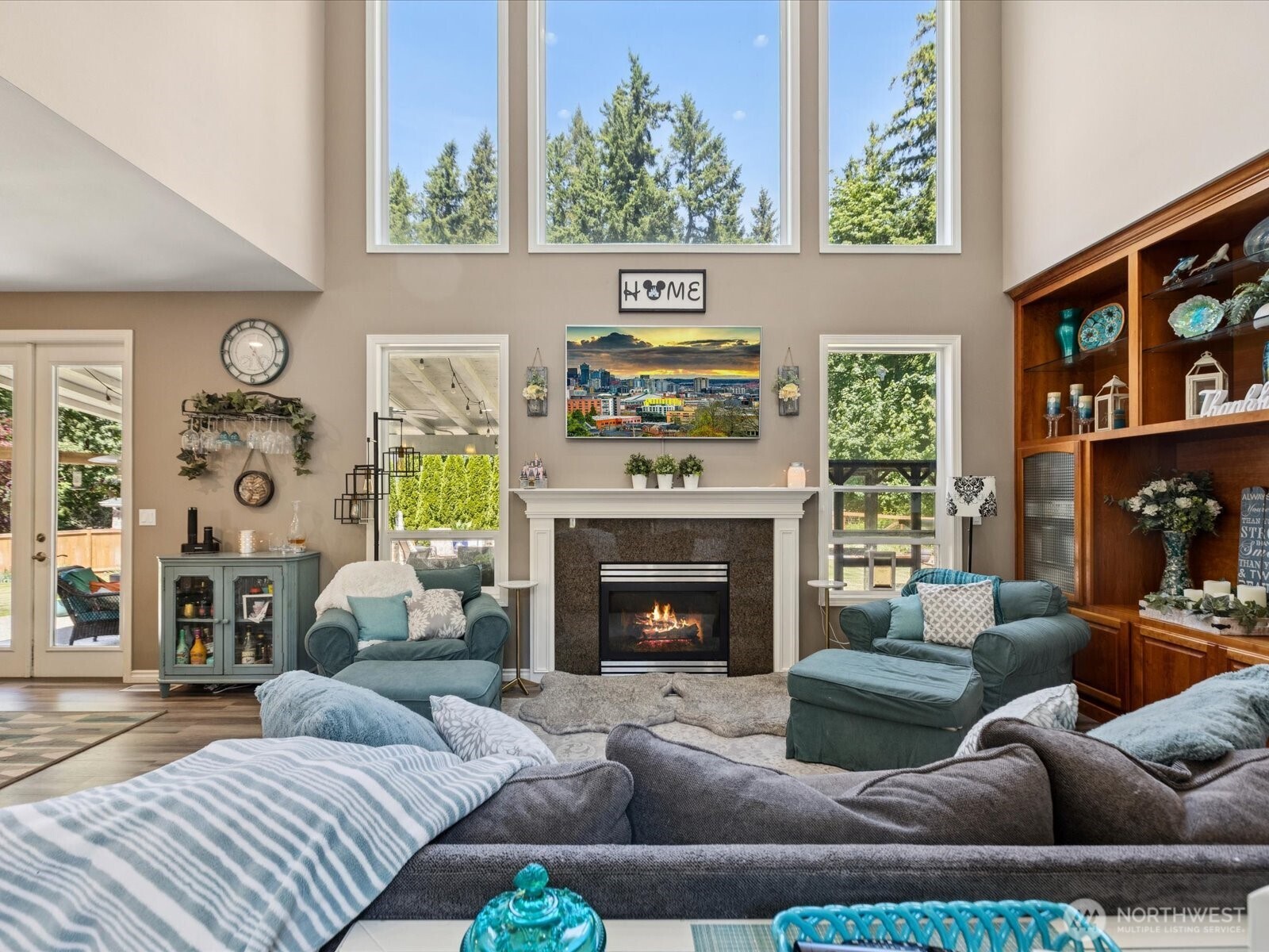 8817 Lakewood Road Stanwood, WA 98292 - Photo 15 of 40 a living room with furniture a fireplace and a window