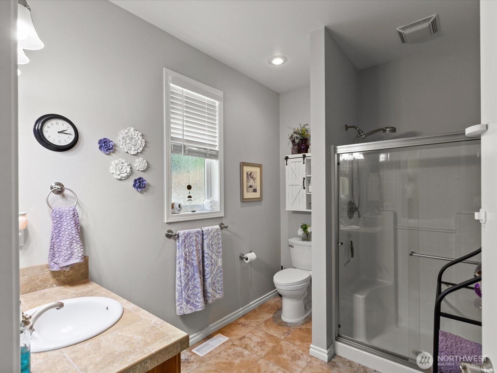 8817 Lakewood Road Stanwood, WA 98292 - Photo 18 of 40 a bathroom with a granite countertop sink a toilet and shower