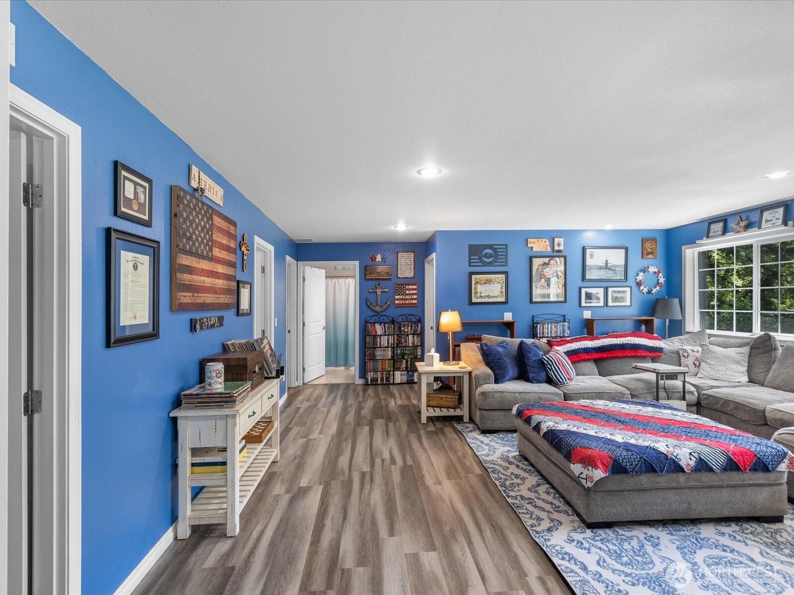 8817 Lakewood Road Stanwood, WA 98292 - Photo 30 of 40 a living room with furniture and wooden floor