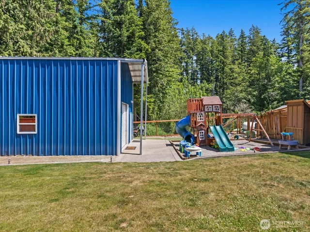 a view of outdoor space with wooden fence and plants