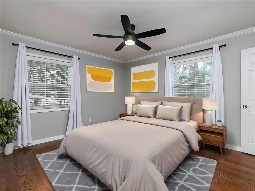 3249 Howell Drive Smyrna, GA 30080 - Photo 17 of 26 a bedroom with a bed and wooden floor