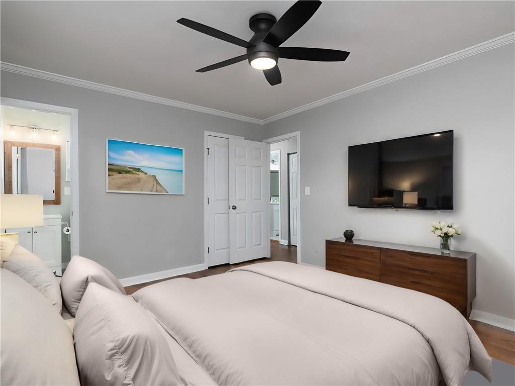 3249 Howell Drive Smyrna, GA 30080 - Photo 18 of 26 a bedroom with a bed and a flat screen tv