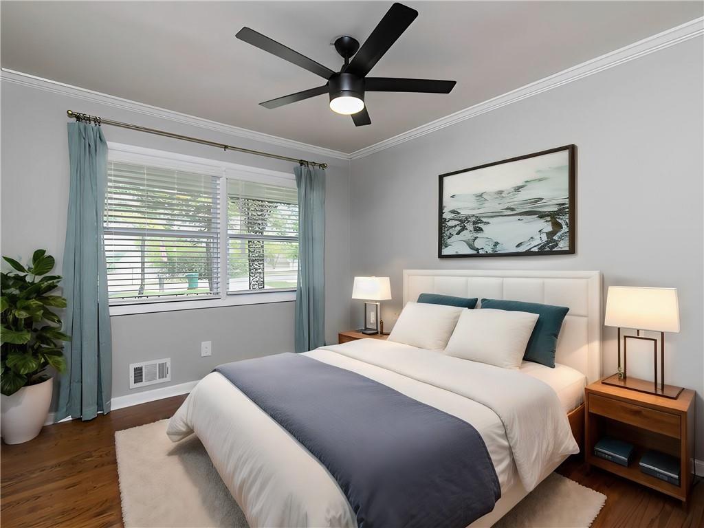 3249 Howell Drive Smyrna, GA 30080 - Photo 21 of 26 a bedroom with a large bed and a potted plant