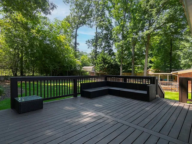 a view of balcony with deck and wooden floor