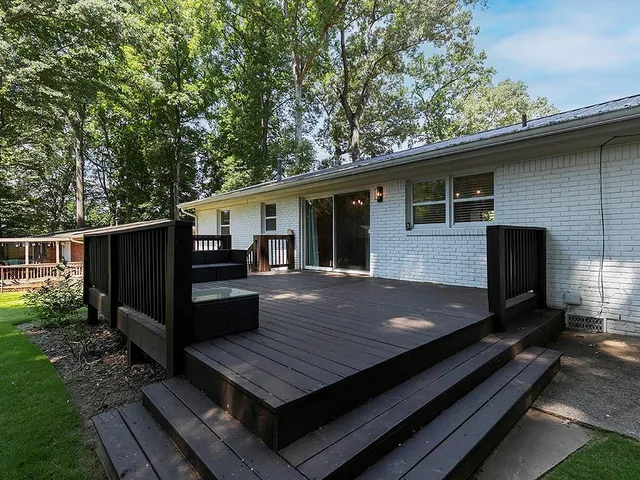 a view of sitting area on deck and wooden floor