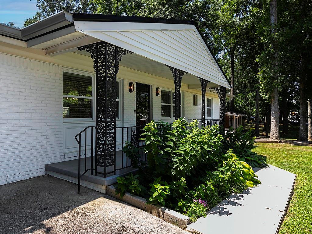 3249 Howell Drive Smyrna, GA 30080 - Photo 3 of 26 a front view of a house with garden