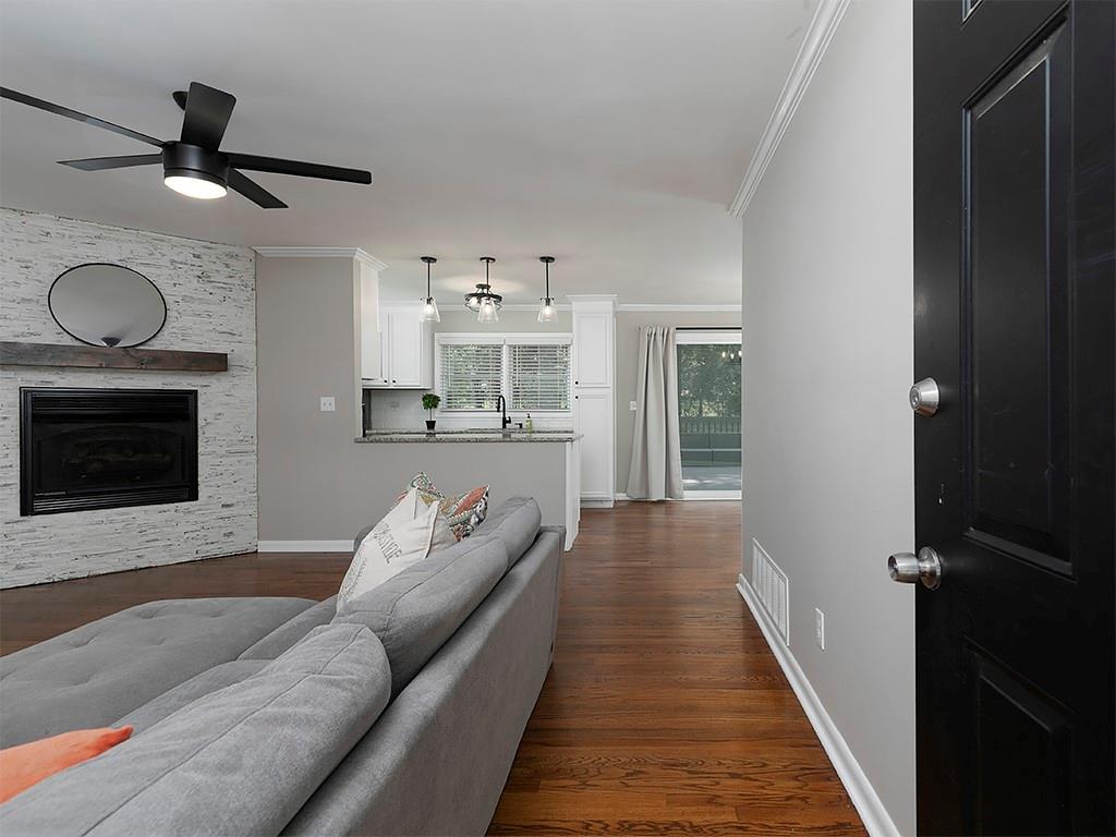 3249 Howell Drive Smyrna, GA 30080 - Photo 4 of 26 a living room with furniture and a fireplace