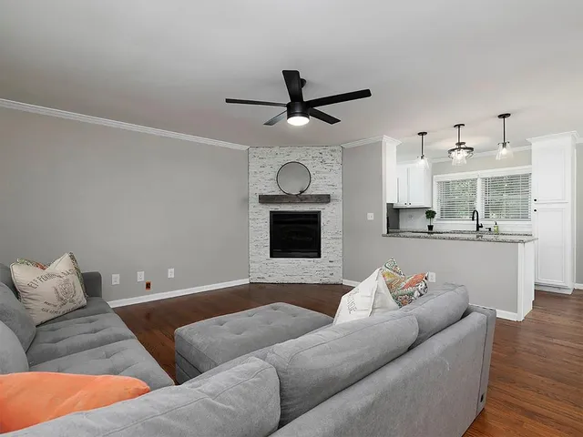 a living room with furniture and a fireplace