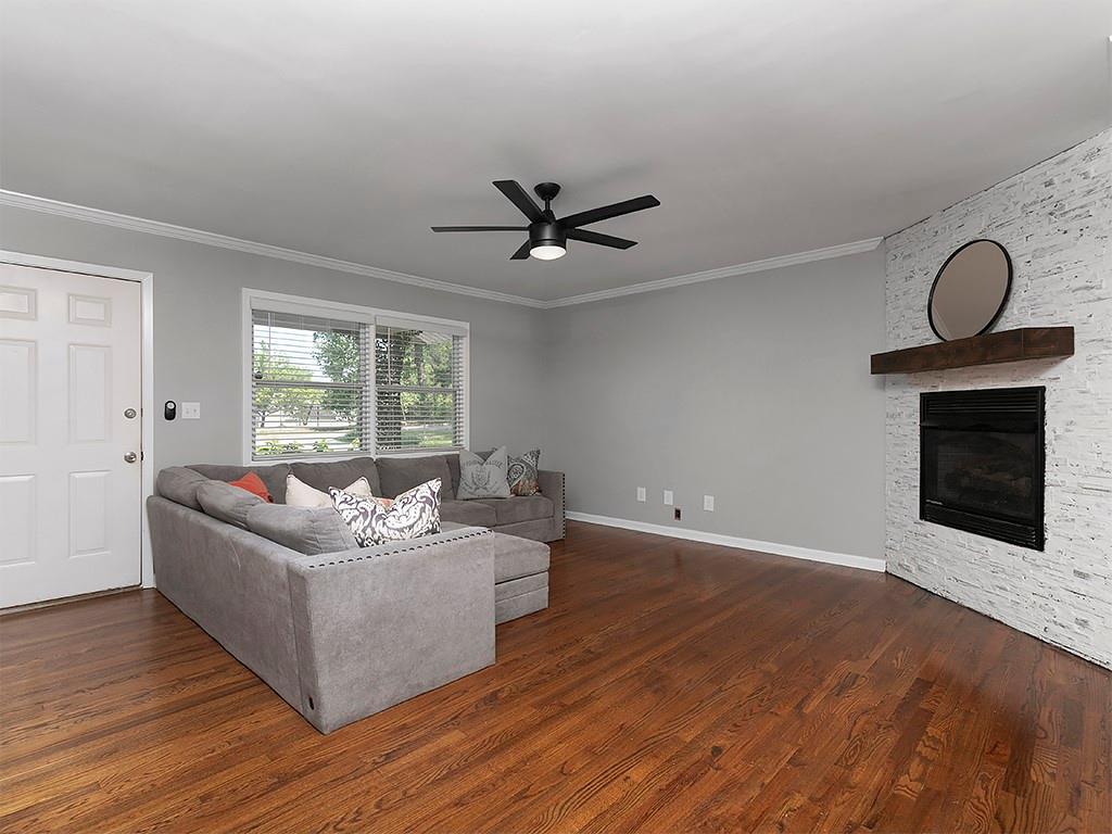 3249 Howell Drive Smyrna, GA 30080 - Photo 7 of 26 a living room with furniture and a fireplace