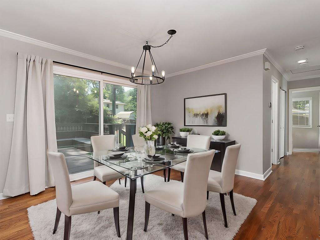 3249 Howell Drive Smyrna, GA 30080 - Photo 10 of 26 a dining room with furniture wooden floor and a chandelier