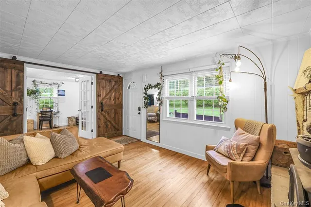 a living room with furniture and a window