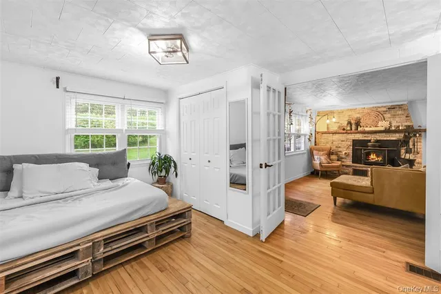 a bedroom with furniture and a window